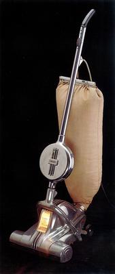 De Luxe model with automatic cord control; aluminum cased vacuum with cloth bag